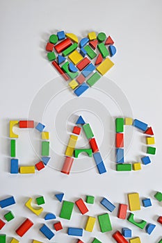 DAD and a heart with colorful wooden toy blocks