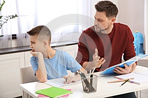 Dad helping his son with difficult homework assignment