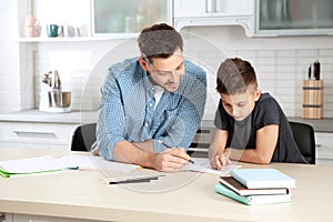 Dad helping his son with homework