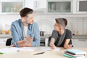 Dad helping his son with homework