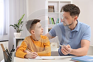 Dad helping his son with homework