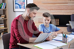 Dad helping his son with homework