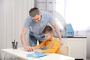 Dad helping his son with homework