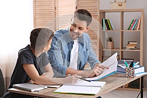 Dad helping his son with homework