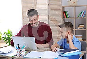 Dad helping his son with homework