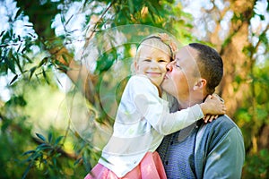 Dad with his beloved daughter outdoors