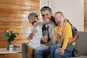 Dad and his children having fun at home. Happy Father`s Day