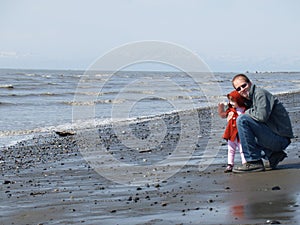 Dad and his daughter at the beach