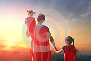 Dad and his daughters are playing photo