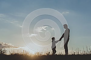 Dad and his kid spending time on nature