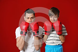 Dad and his son with boxing gloves