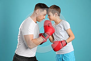 Dad and his son with boxing gloves