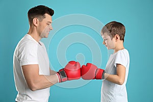 Dad and his son with boxing gloves