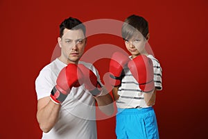 Dad and his son with boxing gloves