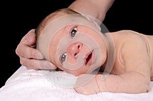 Dad holding babies head up