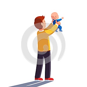 Dad holding baby son in both hands and raising him