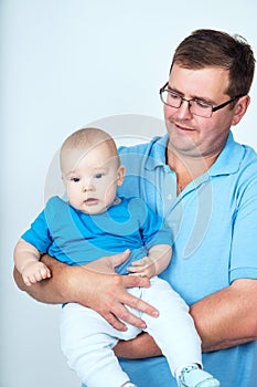 Dad holding infant son