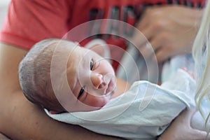 Dad holding newborn baby