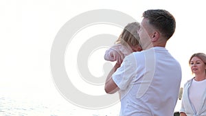 dad holds a little girl in his arms against father's love for the child point dad love children the only child pink