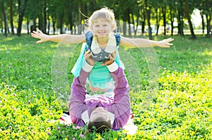 Dad keeps daughter in her arms in nature