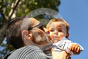 Dad Kissing Baby