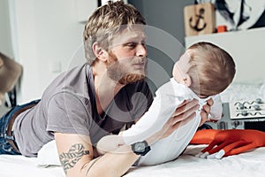 Dad and little son in the bedroom