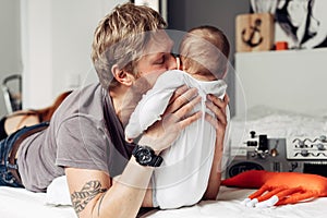 Dad and little son in the bedroom