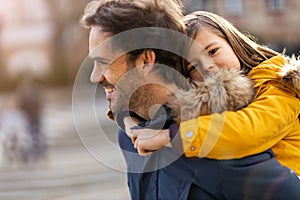 Dad and little son hugging outdoors