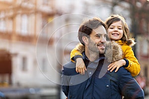 Dad and little son hugging outdoors