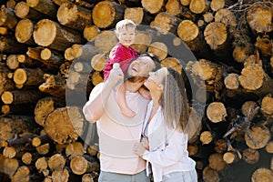 Dad, mom and baby son have fun in the fresh air. A happy family spends happy moments of their life