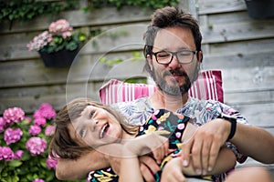 Dad playing with his daughter