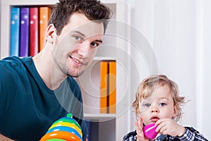 Dad playing with son