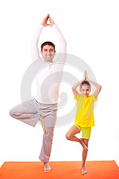 Dad practicing yoga with daughter isolated