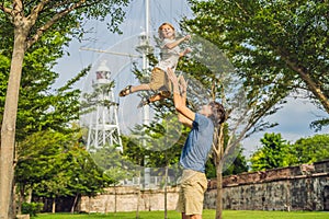 Dad and son on background of Fort Cornwallis in Georgetown, Pena