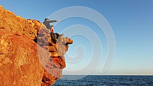 dad and son contemplate the beauty of nature. Freedom. Cinematic look. A man with child on the beach looks into the