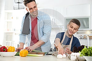 Dad and son cooking together