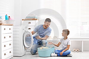 Dad and son doing laundry