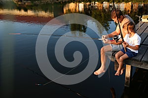 Dad and son fishing together