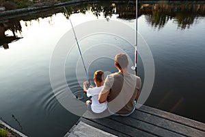 Dad and son fishing together