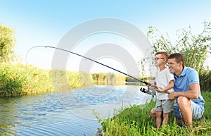 Dad and son fishing together