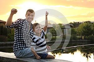 Dad and son fishing together