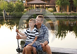 Dad and son fishing together