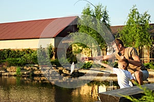 Dad and son fishing together