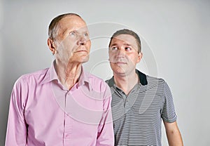 Dad and son on grey background