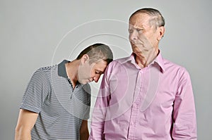 Dad and son on grey background