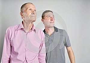 Dad and son on grey background