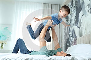 Dad and son having fun at home. Happy Father`s Day