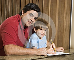 Dad and son with homework.