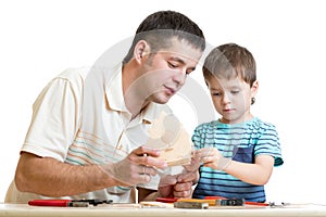 Dad and son kid make nesting box