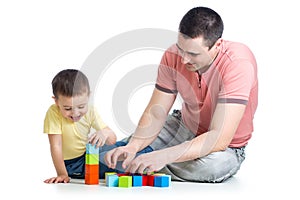 Dad and son kid playing construction game together